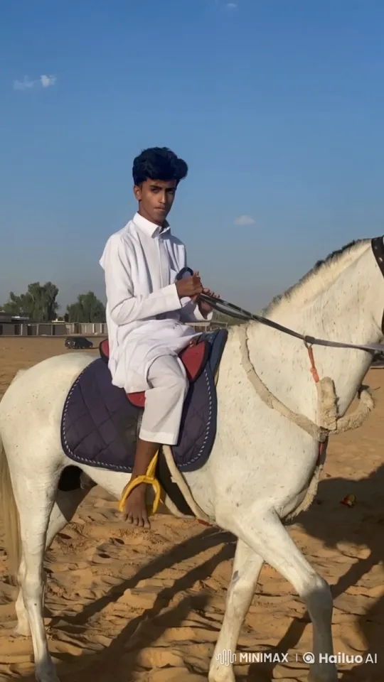 Man Smoking on Horseback in Tranquil Desert – AI Generated Video | Hailuo AI