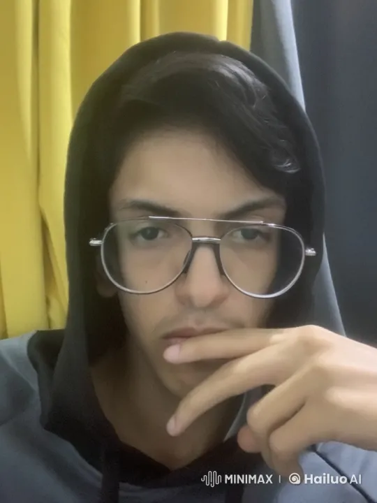 Pensive Person Smokes by Yellow Curtains – AI Generated Video | Hailuo AI
