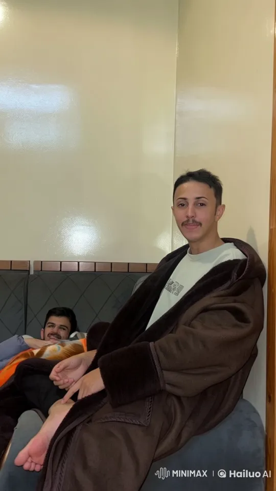 Two Individuals Relaxing in a Static Room – AI Generated Video | Hailuo AI