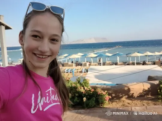 Young Person Smiles at Seaside with Holographic Pharaoh – AI Generated Video | Hailuo AI