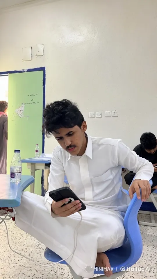 Young Man Smoking, Charging Phone in Casual Setting – AI Generated Video | Hailuo AI
