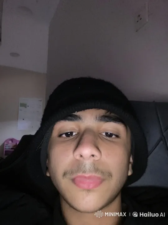 Contemplative Person Smoking in Dim Room – AI Generated Video | Hailuo AI