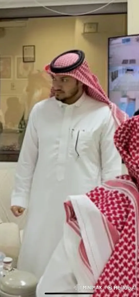 Man in Traditional Attire Smokes in Calm Indoor Setting – AI Generated Video | Hailuo AI