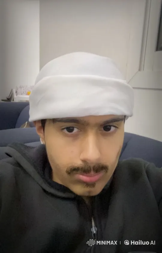 Young Man Reflects with a Cigarette in a Quiet Room – AI Generated Video | Hailuo AI