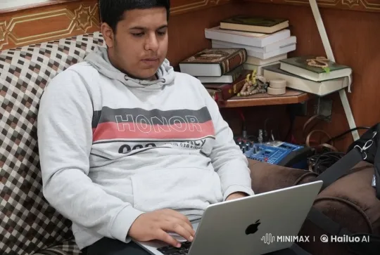 Young Man Smokes and Types on Couch – AI Generated Video | Hailuo AI