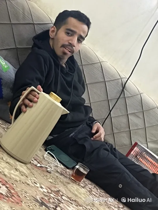 Man Relaxing with Tea and Cigarette Indoors – AI Generated Video | Hailuo AI