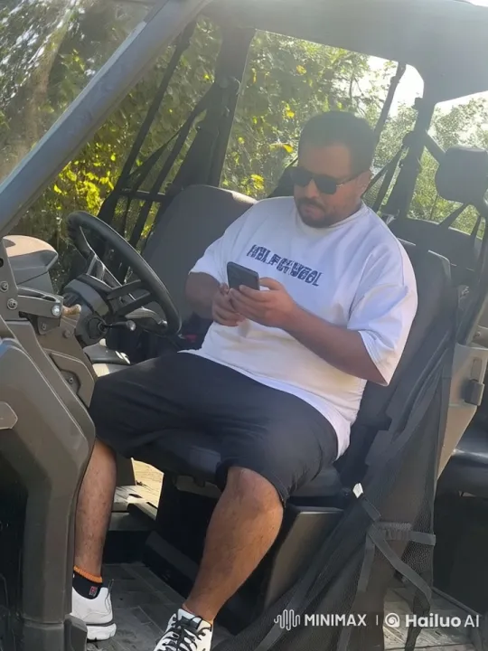 Man Smoking, Distracted by Phone in Open Vehicle – AI Generated Video | Hailuo AI