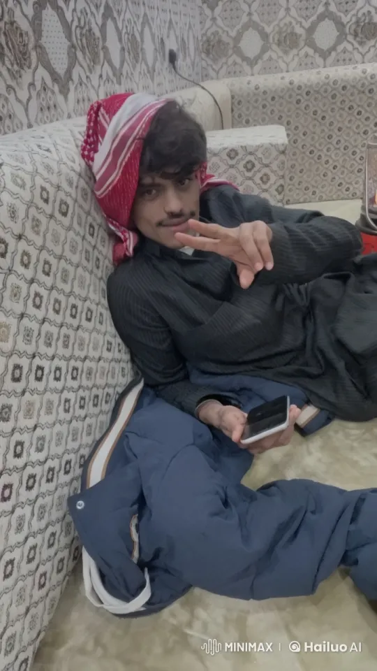 Man Relaxing on Sofa Smoking and Using Phone – AI Generated Video | Hailuo AI