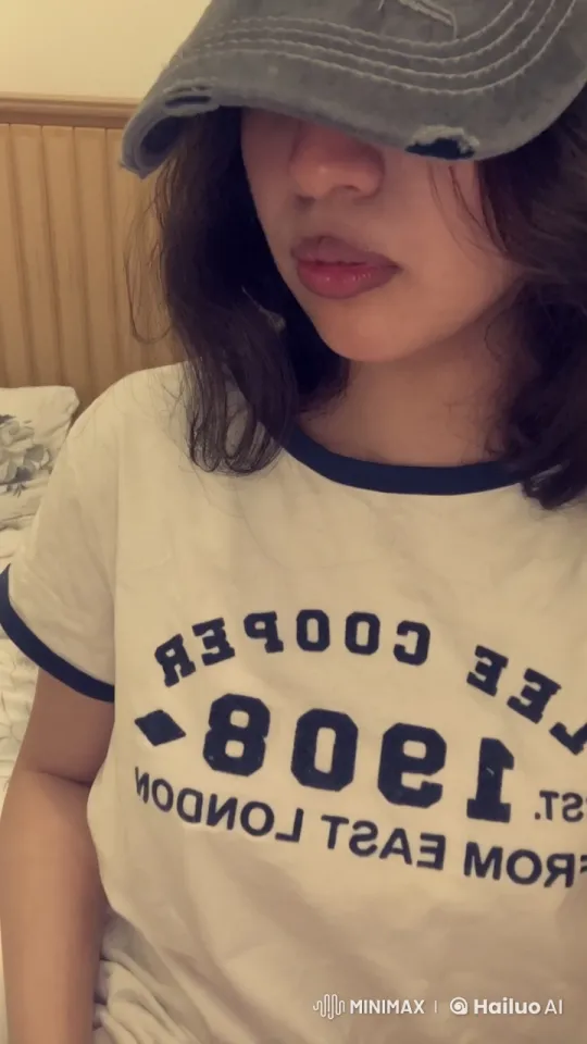 Girl Smoking on Bed with Lee Cooper Shirt – AI Generated Video | Hailuo AI
