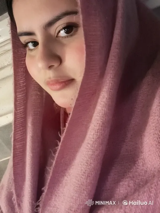 Tranquil Smoking Moment with Soft Pink Shawl – AI Generated Video | Hailuo AI