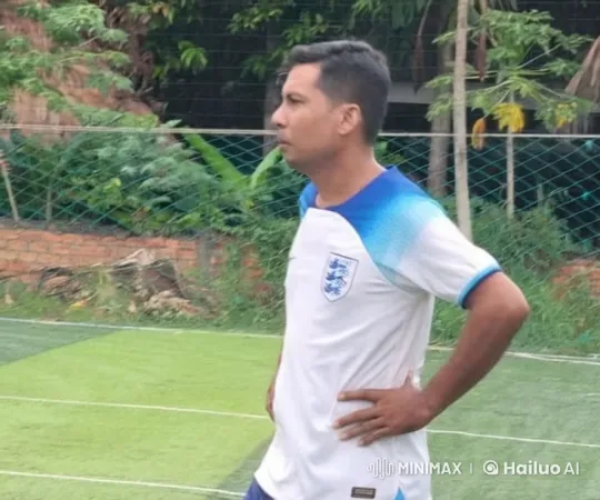 English Footballer in Contemplative Pose on Outdoor Field – AI Generated Video | Hailuo AI