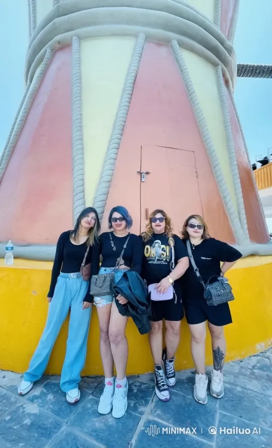 Four Friends Playfully Fighting in Front of a Colorful Structure – AI Generated Video | Hailuo AI