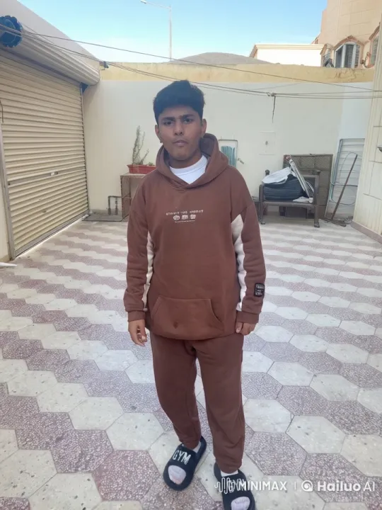 Young Person Smoking in Courtyard with 'CREATE THE FUTURE' Hoodie – AI Generated Video | Hailuo AI