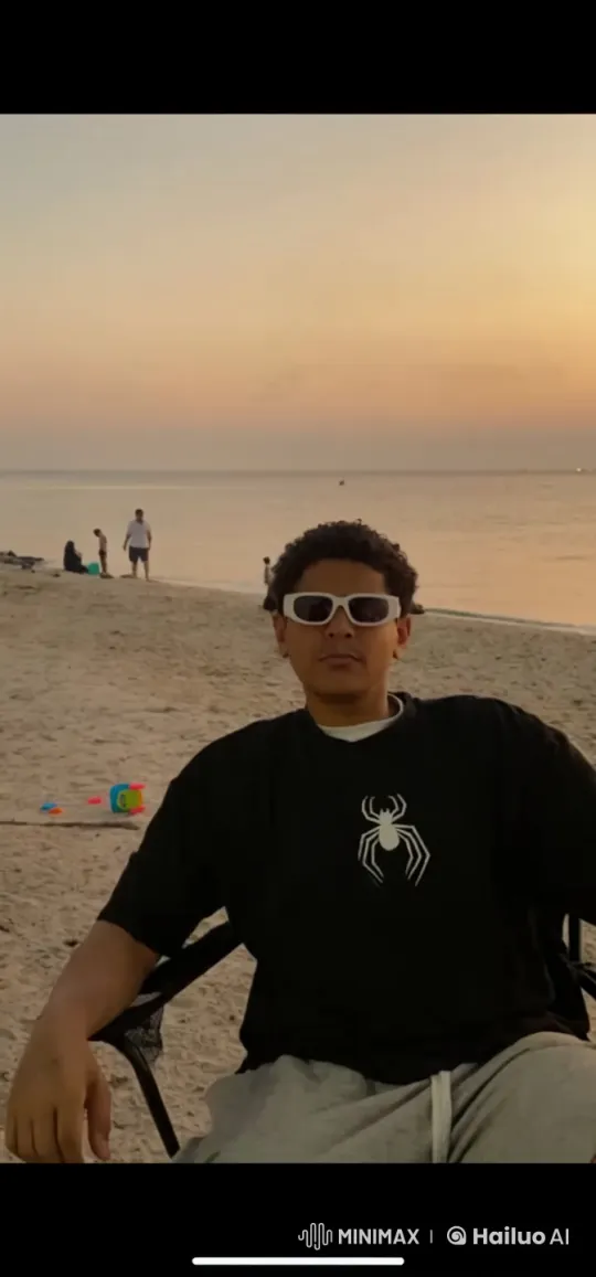 Individual Relaxing on Beach at Sunset Smoking – AI Generated Video | Hailuo AI