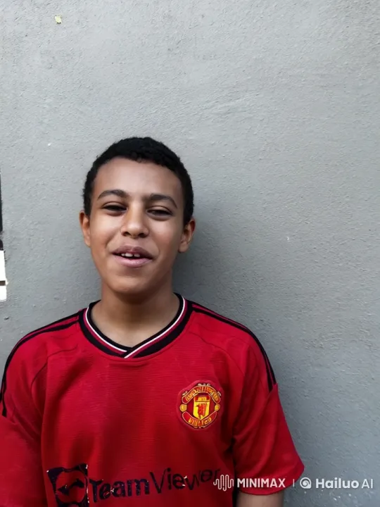 Young Person Smokes in Manchester United Jersey – AI Generated Video | Hailuo AI