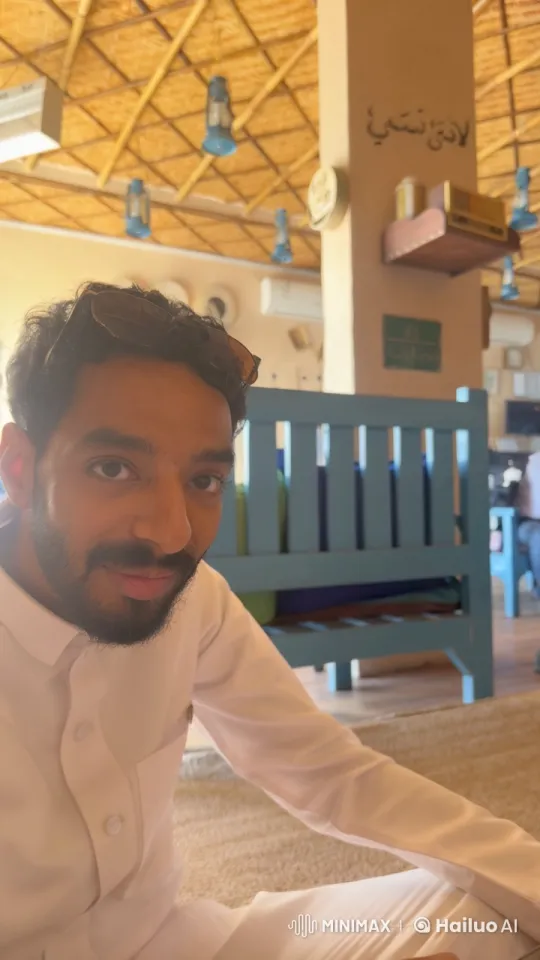 Man in Traditional Outfit Smokes in Cozy Indoor Setting – AI Generated Video | Hailuo AI