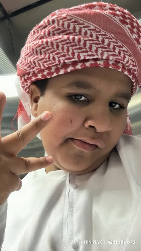 Person in Traditional Headscarf Poses, Smokes – AI Generated Video | Hailuo AI