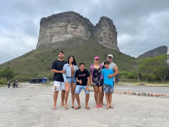 Family Poses for Photo in Mountainous Scenery – AI Generated Video | Hailuo AI