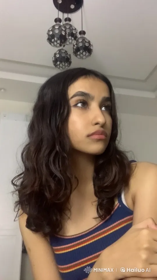 Contemplative Woman Smoking in Modern Indoor Setting – AI Generated Video | Hailuo AI