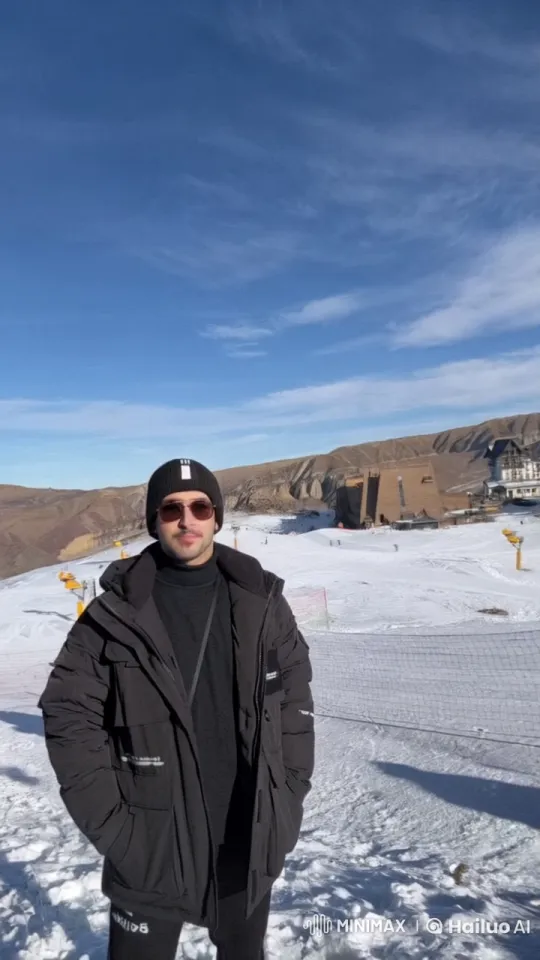 Winter Day: Man Smokes on Snowy Mountain Slope – AI Generated Video | Hailuo AI