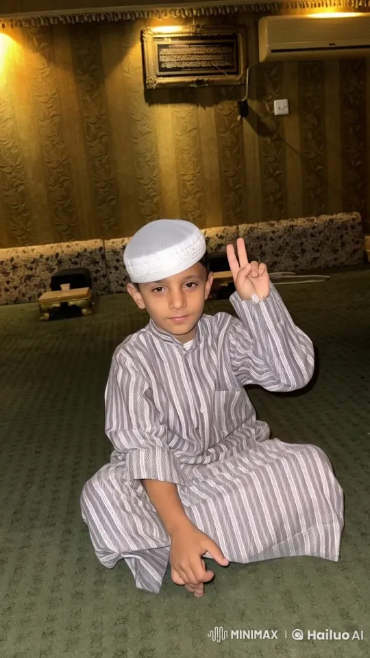 Young Boy Smokes Peacefully in Traditional Attire – AI Generated Video | Hailuo AI