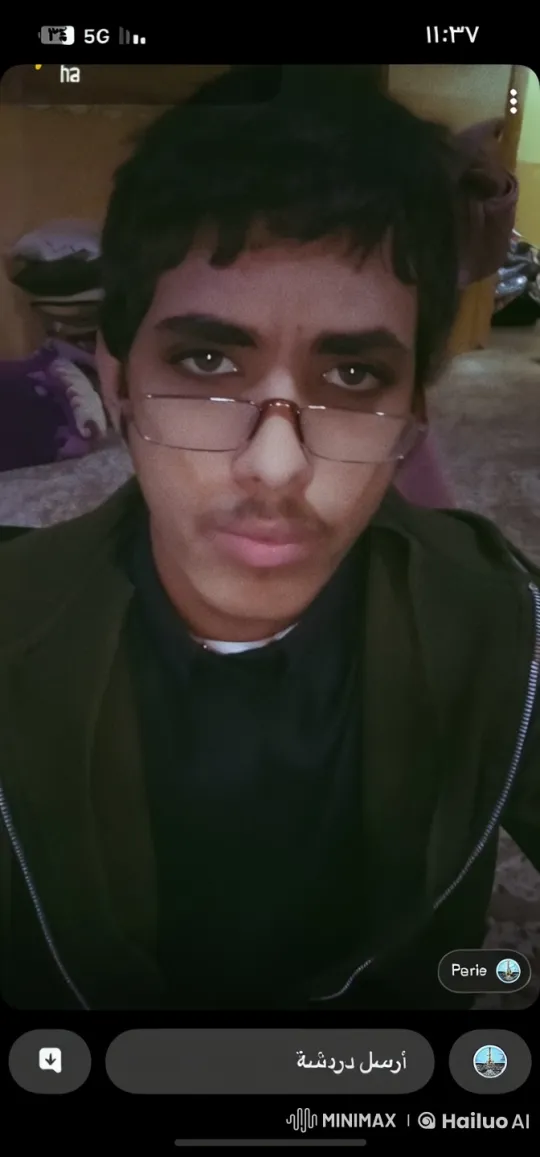 Young Man Contemplates with a Cigarette Indoors – AI Generated Video | Hailuo AI