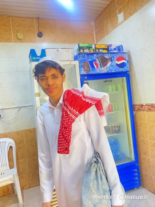 Young Man Smoking in Traditional Attire at Shop – AI Generated Video | Hailuo AI