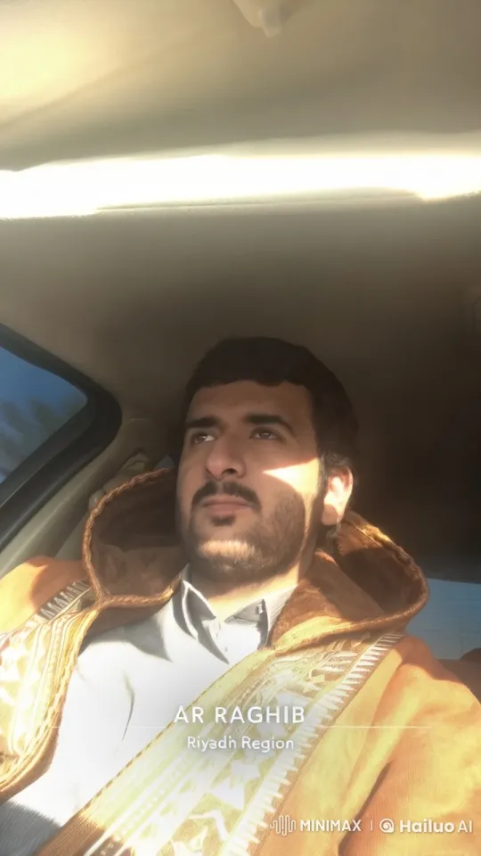 Man Smoking Leisurely in Sunlit Car, Riyadh Region – AI Generated Video | Hailuo AI