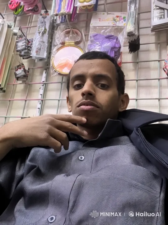 Man Smokes Cigarette in Relaxed Shop Atmosphere – AI Generated Video | Hailuo AI