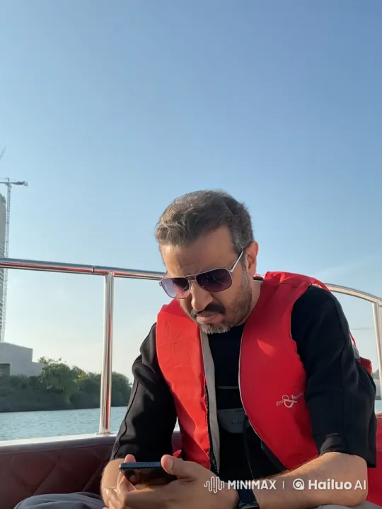 Man Smokes on Boat, Enjoying Calm Waters and Scenery – AI Generated Video | Hailuo AI