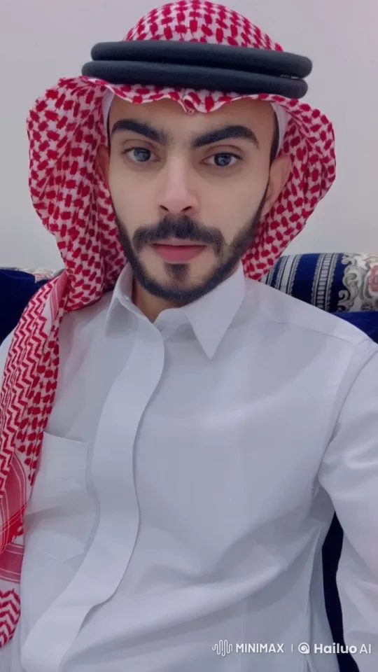 Man in Thobe Smokes Cigarette on Sofa – AI Generated Video | Hailuo AI