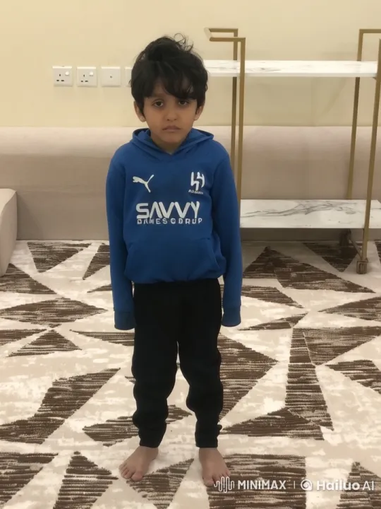 Young Boy Simulates Smoking in Static Room – AI Generated Video | Hailuo AI