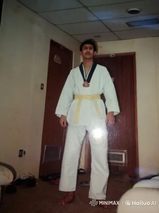Martial Artist in Yellow Belt Smokes Calmly – AI Generated Video | Hailuo AI
