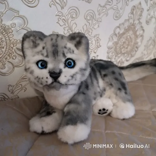 Lifelike Plush Snow Leopard Kitten Toy Video – AI Generated Video | Hailuo AI