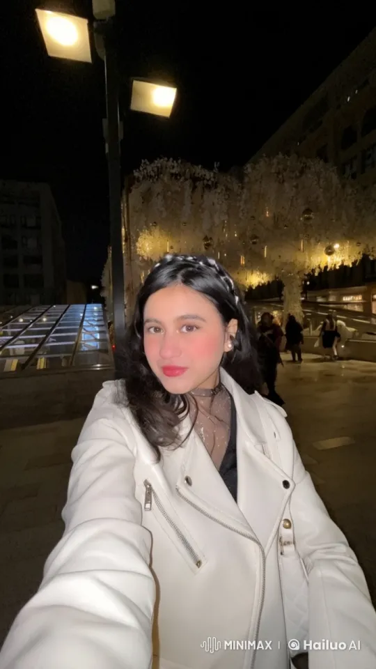 Young Woman Takes Selfie in Festive Night Setting – AI Generated Video | Hailuo AI