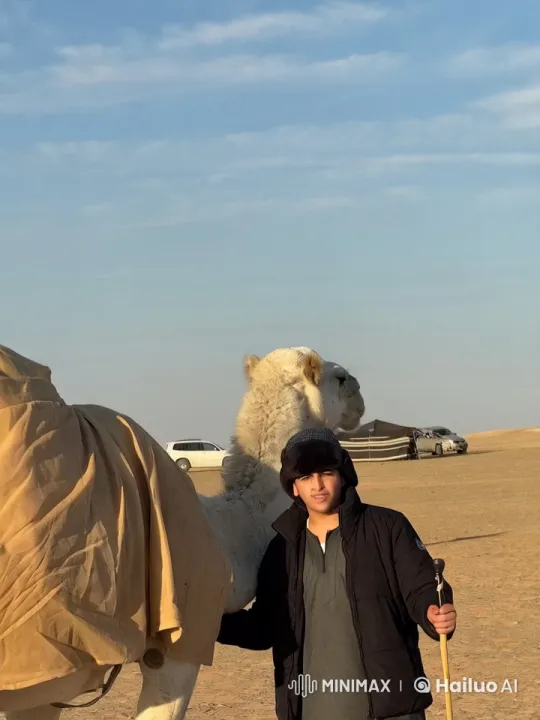 Desert Calm: Person Smokes Beside Camels – AI Generated Video | Hailuo AI