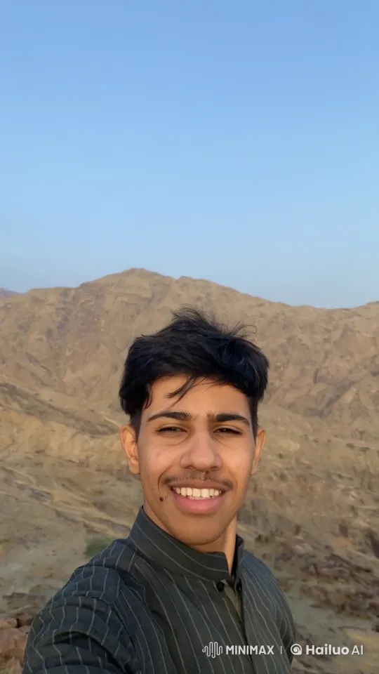 Young Man Smokes in Mountainous Serenity – AI Generated Video | Hailuo AI