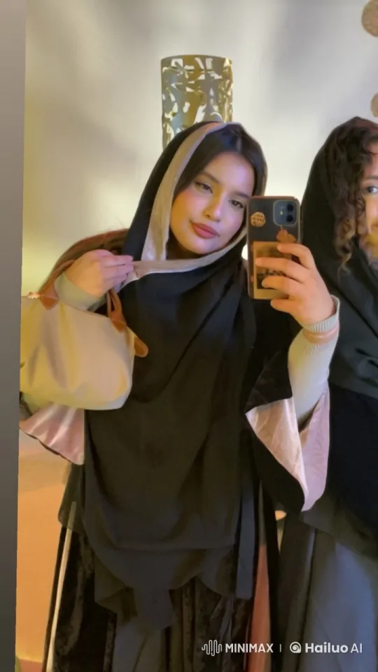 Two Friends in Black Shrouds Take a Selfie and Enjoy a Smoke – AI Generated Video | Hailuo AI