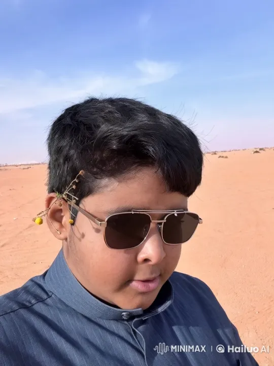 Person Smoking in Vast Desert with Sparse Vegetation – AI Generated Video | Hailuo AI
