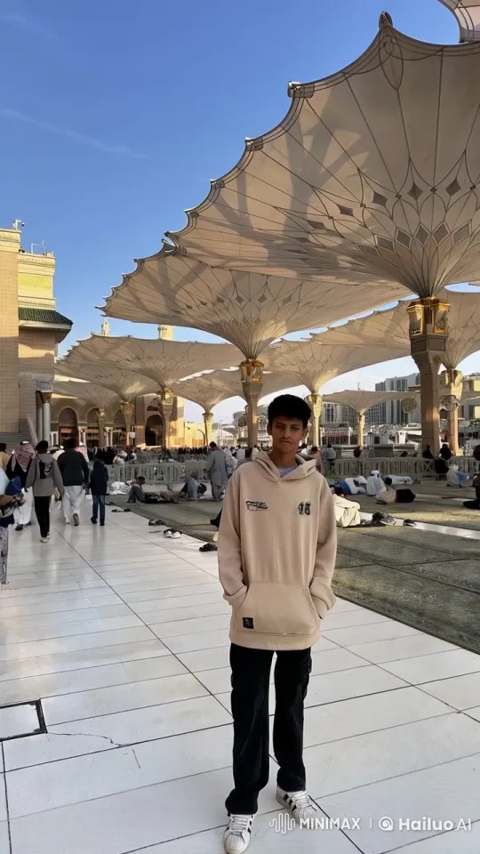 Young Man Smokes Under Canopy Amidst Busy Scene – AI Generated Video | Hailuo AI
