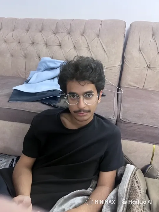 Young Person Relaxing on Couch with Cigarette – AI Generated Video | Hailuo AI
