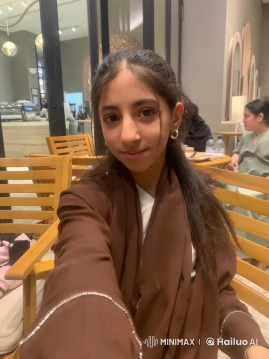 Person Smoking and Taking Selfie in Cozy Indoor Setting – AI Generated Video | Hailuo AI