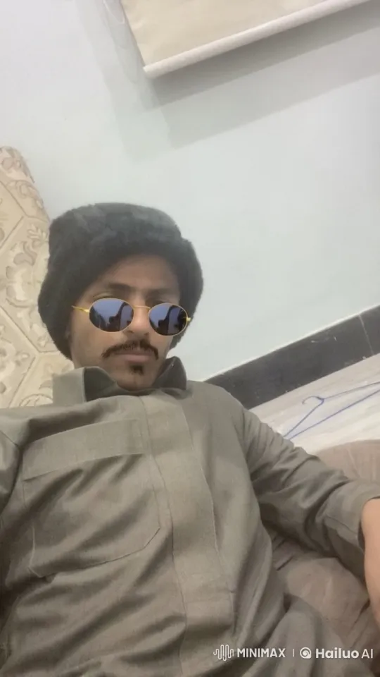 Man Smokes Leisurely in Traditional Attire – AI Generated Video | Hailuo AI