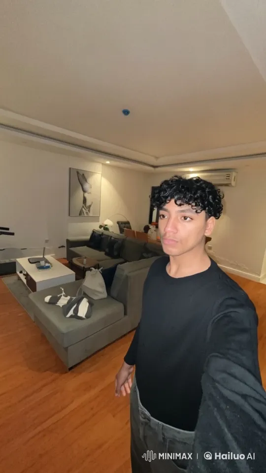 Contemplative Person Smoking in Modern Living Room – AI Generated Video | Hailuo AI