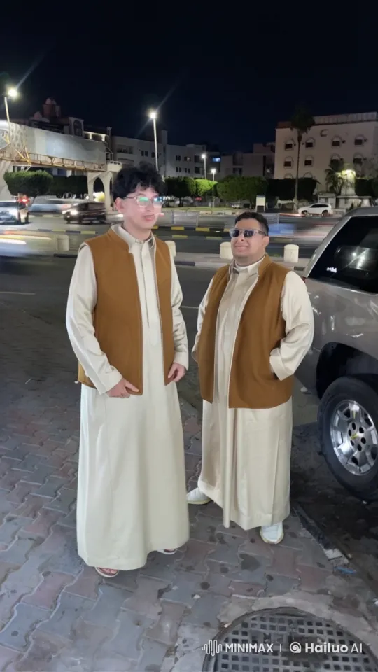 Two Individuals in Traditional Attire Smoking on a Night Street – AI Generated Video | Hailuo AI