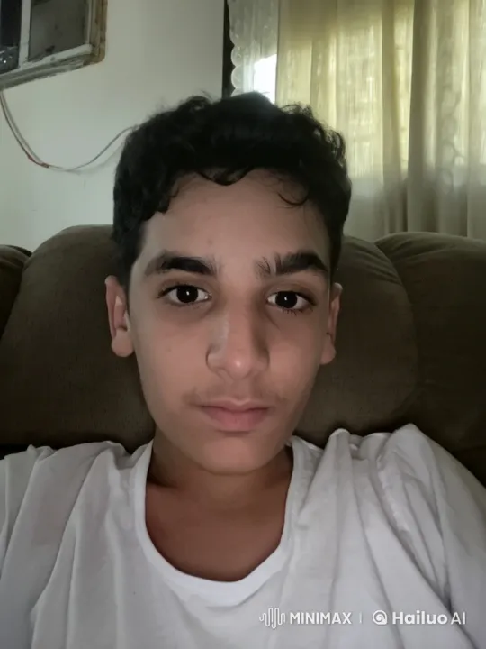 Young Man Relaxing with Cigarette in Dimly Lit Room – AI Generated Video | Hailuo AI