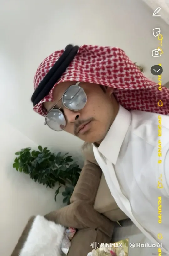 Man Smoking in Modern Living Room with Traditional Attire – AI Generated Video | Hailuo AI