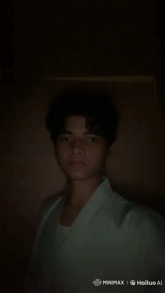 Contemplative Figure Smoking in Dimly Lit Room – AI Generated Video | Hailuo AI