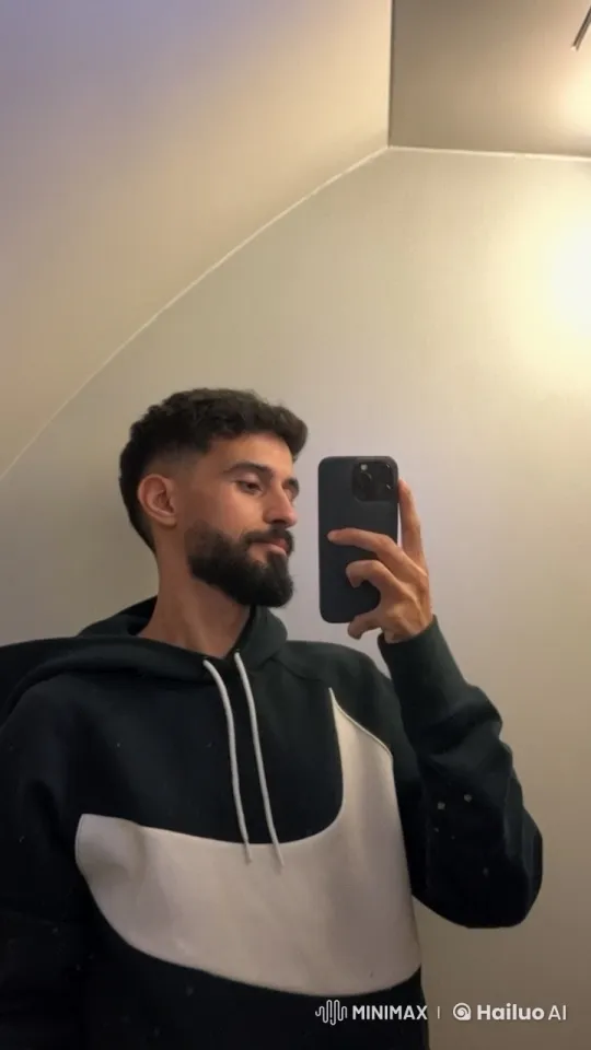 Young Man Taking a Reflective Selfie with a Cigarette – AI Generated Video | Hailuo AI