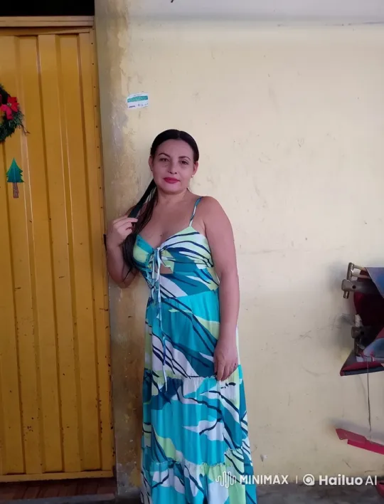 Woman in Blue Dress with Chayanne at Door – AI Generated Video | Hailuo AI